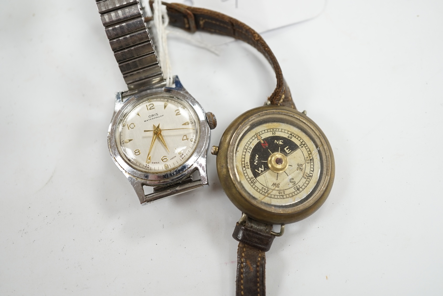 A gentleman's stainless steel Oris manual wind wrist watch and a base metal wrist compass. Condition - poor to fair